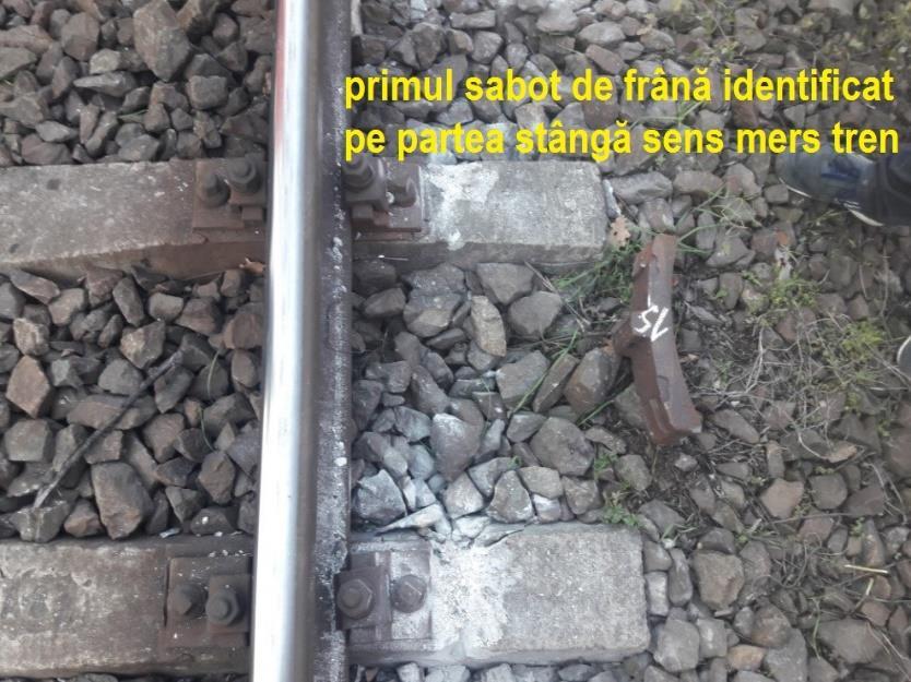 10 cm), iar (în aceeaşi secţiune a căii), urme de coborâre a roţilor din partea dreaptă pe umărul activ al şinei din partea dreaptă, în sensul de mers al trenului. Foto nr.