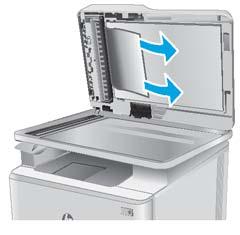 5. Deschideţi capacul scanerului. Dacă hârtia este blocată în spatele contraplăcii din plastic alb, scoateţi-o uşor. 6.